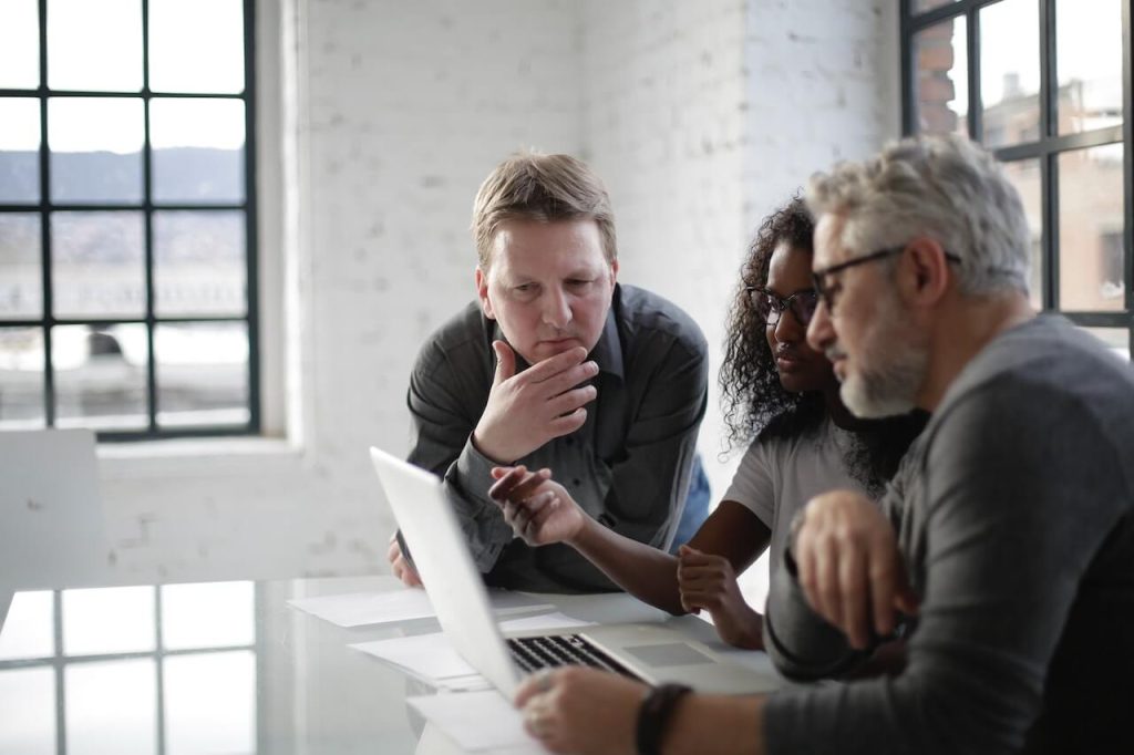 people looking at a computer