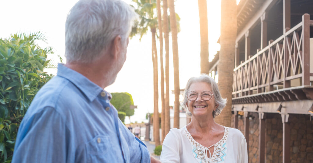 senior couple holding hands