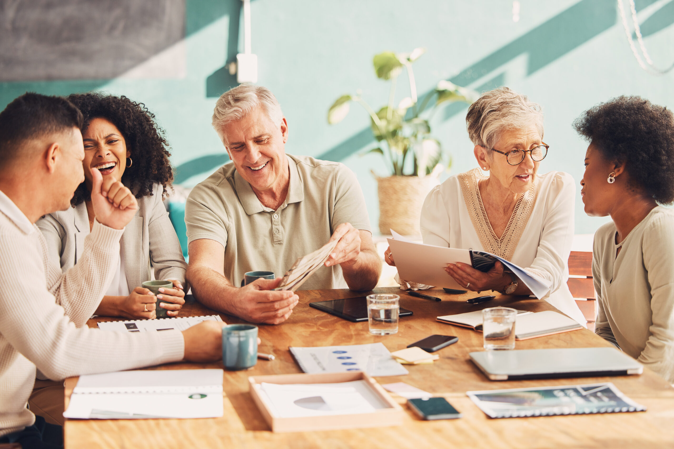 happy people sitting together at a table