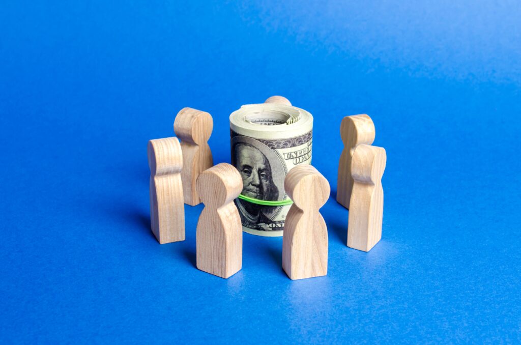 People figures surrounding money and protecting it.