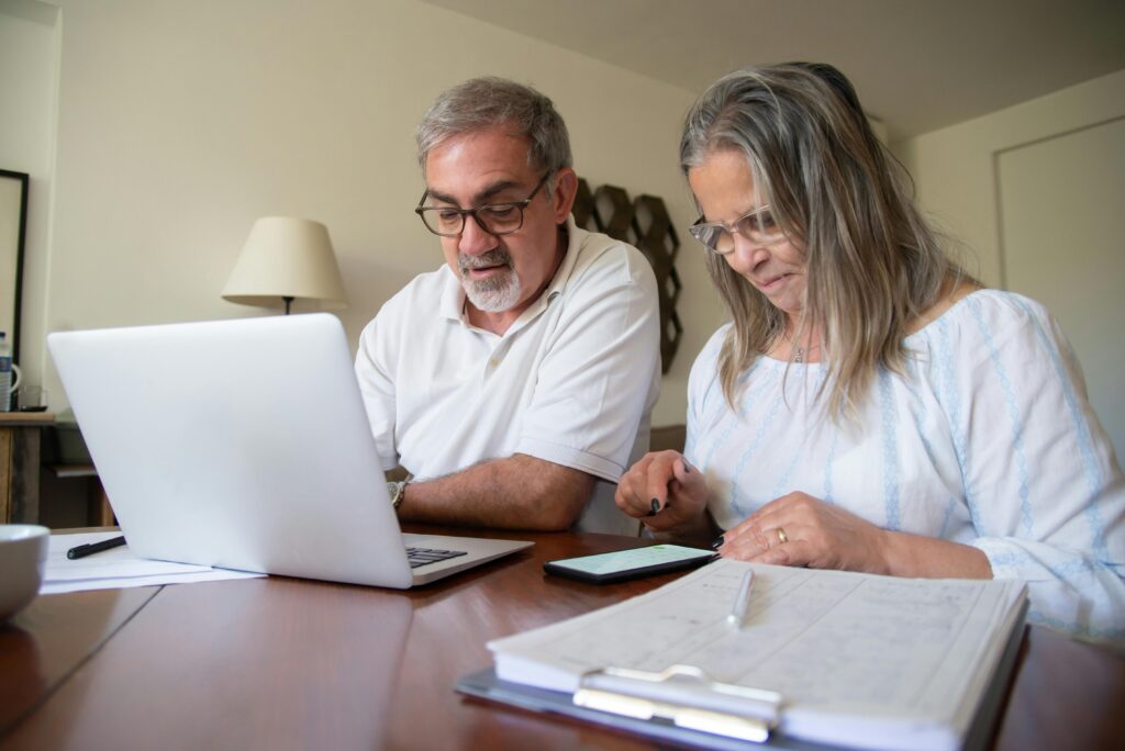 Couple looking into finances for retirement planning.